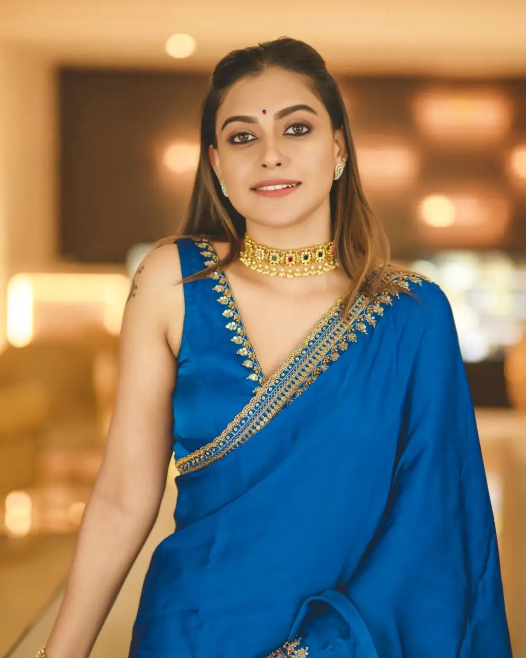 anusree nair in blue saree sleeveless blouse